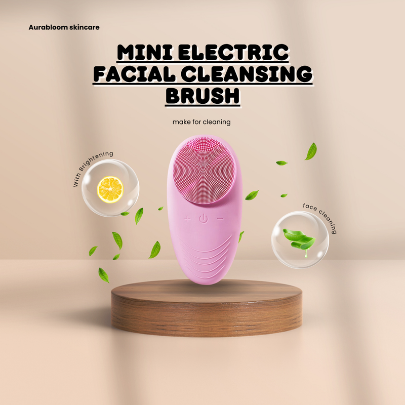 Mini Electric Facial Cleansing Brush on a wooden surface with lemon and green leaf elements, designed for effective face cleaning.
